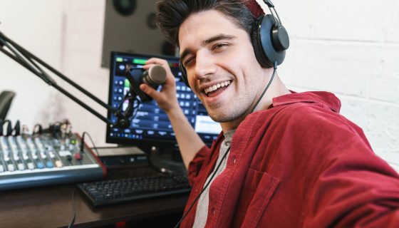 image-of-young-happy-dj-man-wearing-headphones-wor-2021-08-30-02-26-03-utc.jpg